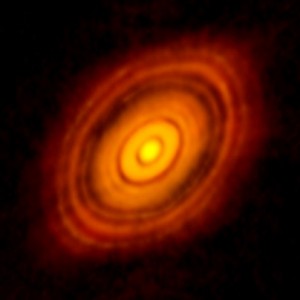 Obraz ALMA przedstawiający młodą gwiazdę HL Tau i jej protoplanetarny dysk..jpg